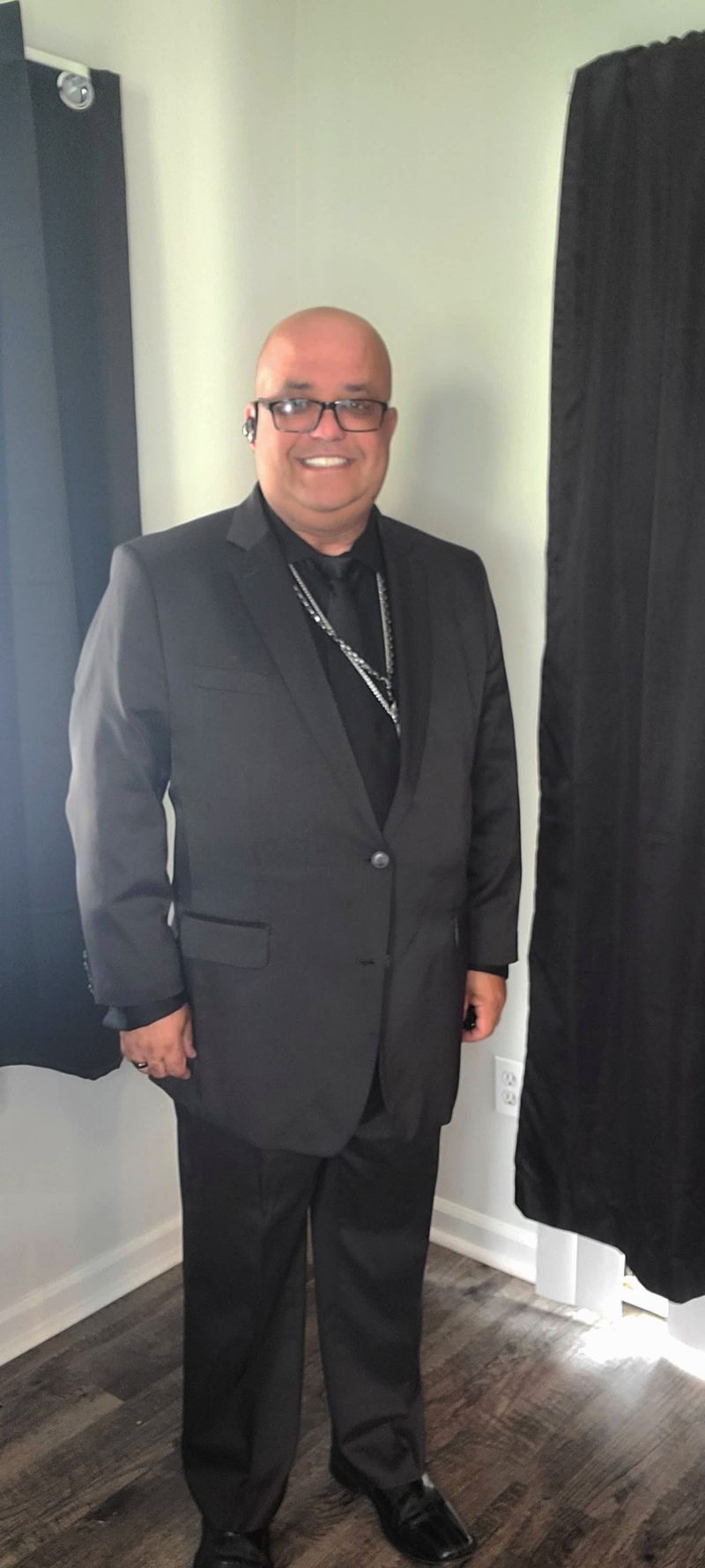 Brother James Lake standing in a dark suit